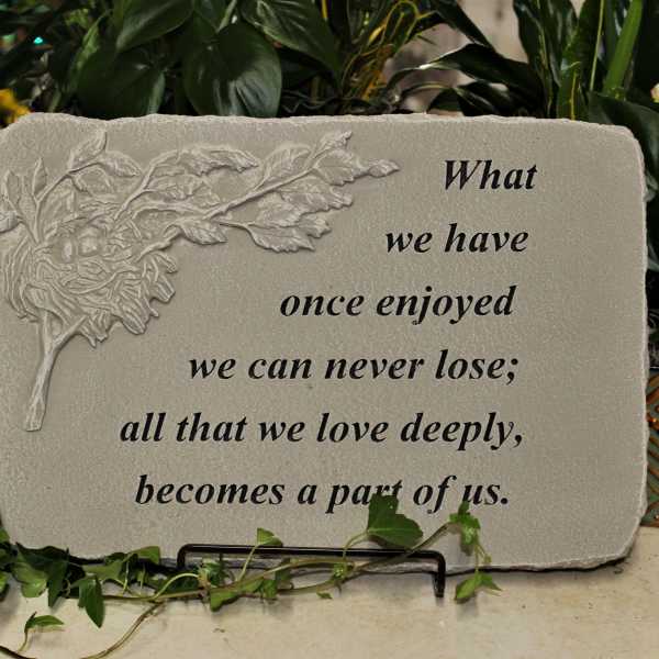 Decorative memorial plaque with a leaf relief and quote