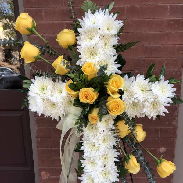 Cross-shaped floral spray with white chrysanthemums and yellow roses