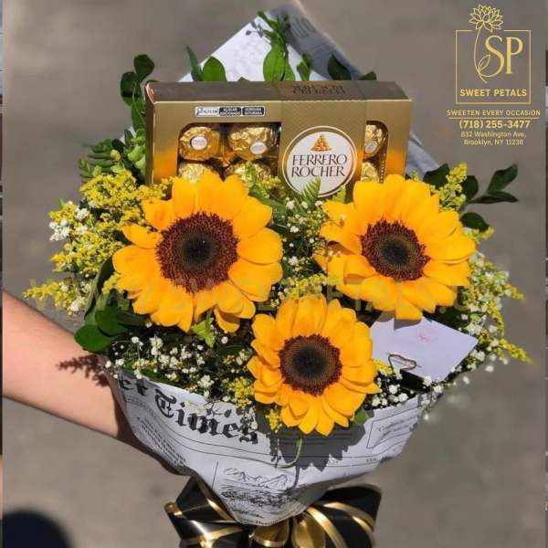 Sunflower bouquet with Ferrero Rocher chocolates and a black-and-gold ribbon