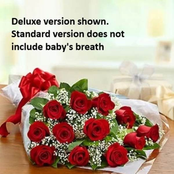 Bouquet of red roses with baby's breath wrapped in white paper