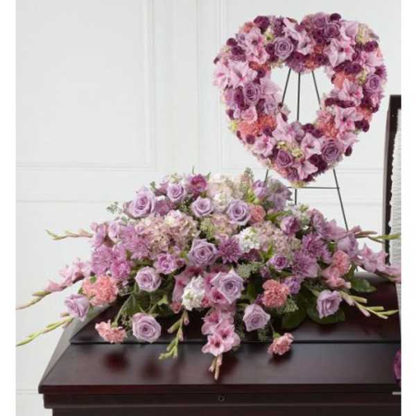 Lavender and pink floral casket spray with a matching heart wreath