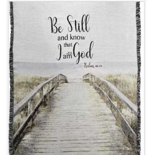 Framed wall hanging with a boardwalk scene and the words "Be Still and know that I am God"