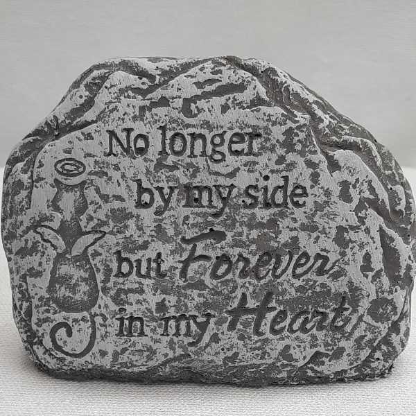Decorative stone with the words "No longer by my side but forever in my heart"