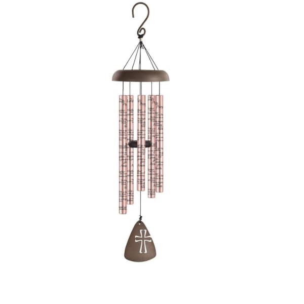 Hanging wind chime with pink tubes and a brown cross-shaped pendant