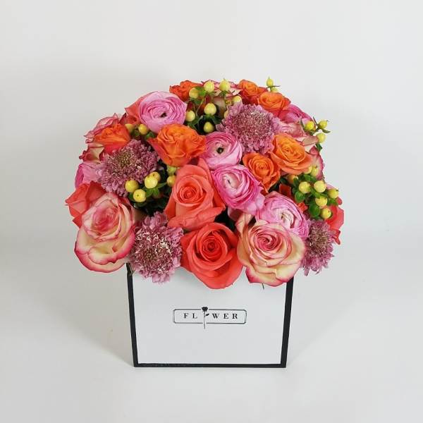 Pink and orange rose bouquet in a white gift box