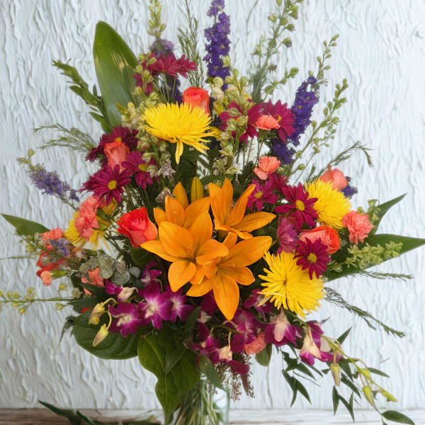 Mixed bouquet with orange lilies, yellow mums, and purple orchids