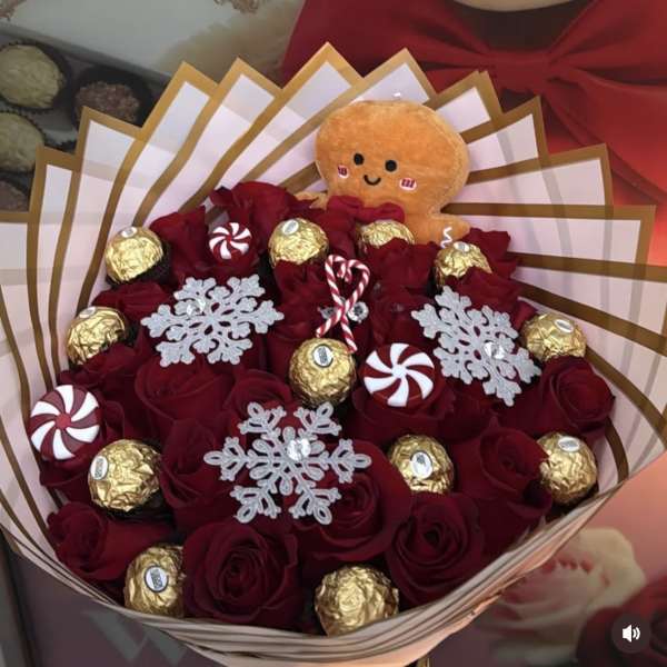 Bouquet of red roses with chocolates and a small plush toy