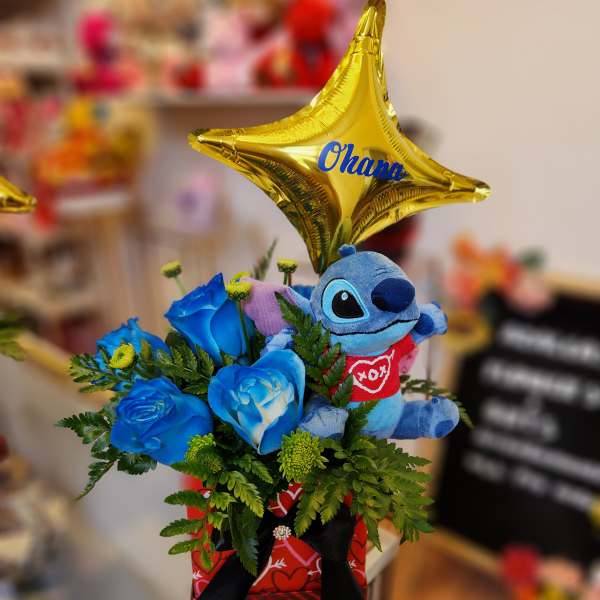 Blue roses with a plush Stitch and gold star balloon in a gift box