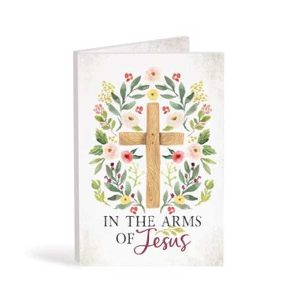 Greeting card with a wooden cross and floral wreath design