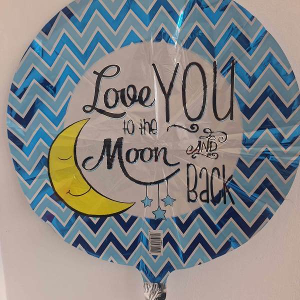 Round blue foil balloon with "Love You to the Moon and Back" text