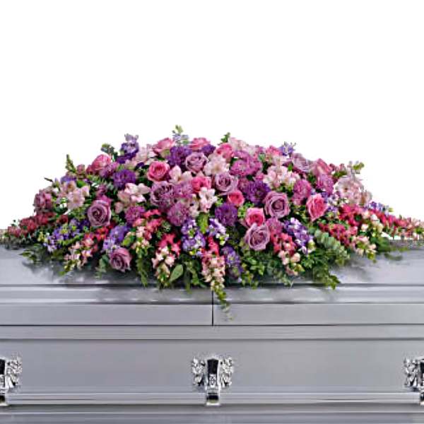 Funeral Casket adorned with Purple and Pink Roses