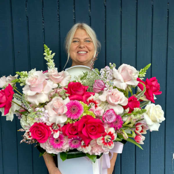 Large bouquet of pink and white roses with gerbera daisies in a white box