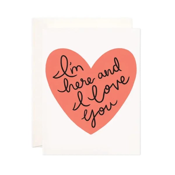 Greeting card with a pink heart and handwritten love message