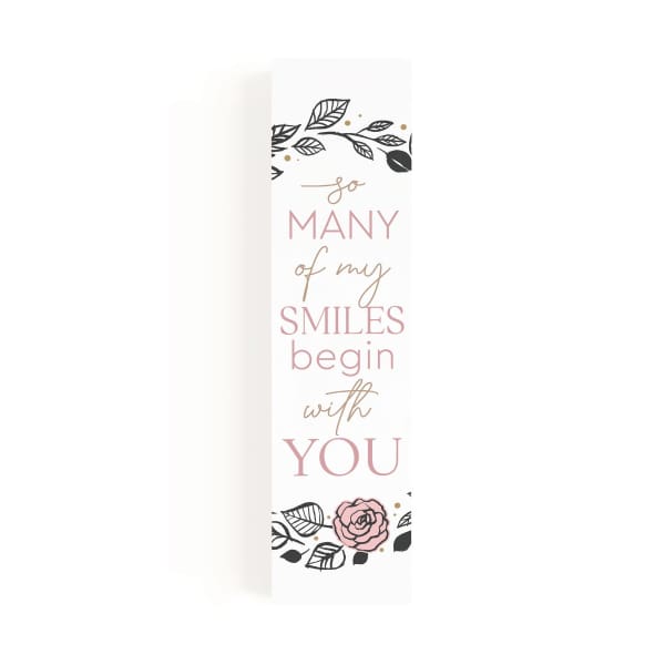 Tall white gift bag with pink floral quote text and rose illustration