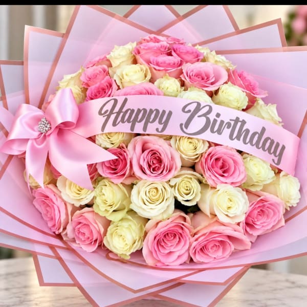 Pink and cream rose bouquet with a Happy Birthday ribbon