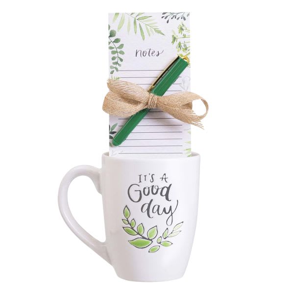 White mug with a notepad and pen tied on top