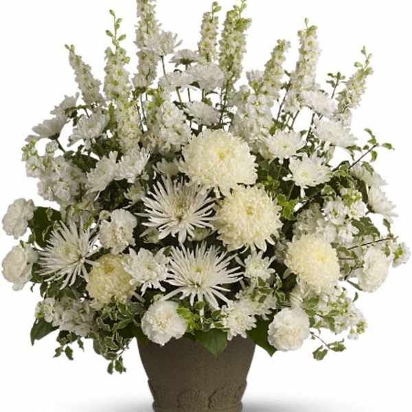 White floral arrangement in a brown vase