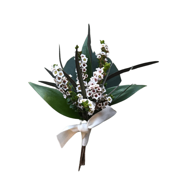 Small bouquet of white flowers with dark green leaves and a white ribbon