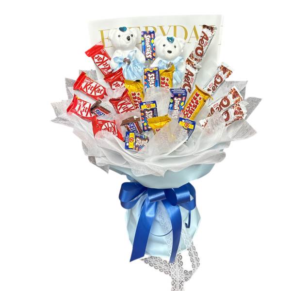 Candy bouquet with two teddy bears and blue ribbon