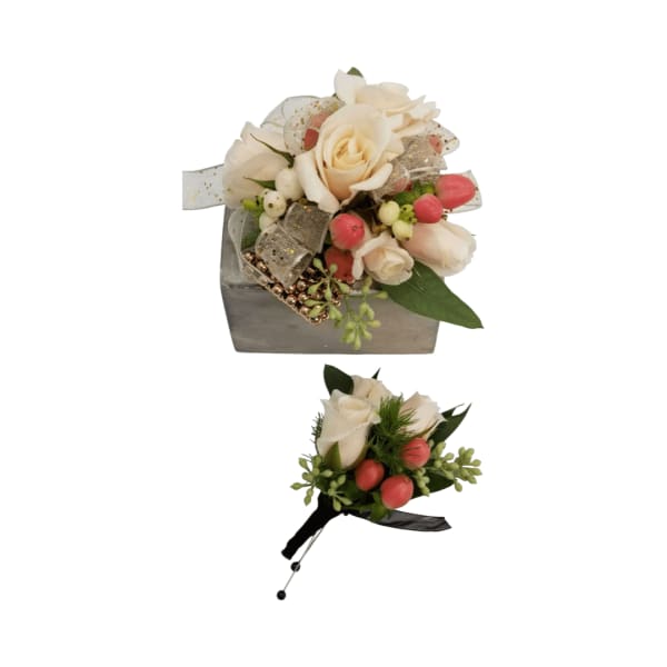 Two small rose arrangements with pink berries and ribbon accents