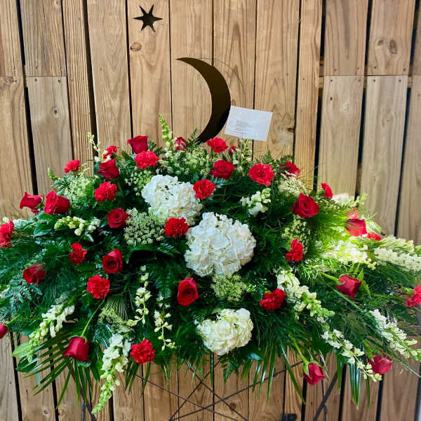 Large red and white floral spray with roses and carnations
