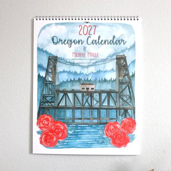 Spiral-bound 2027 Oregon calendar with red roses at the bottom