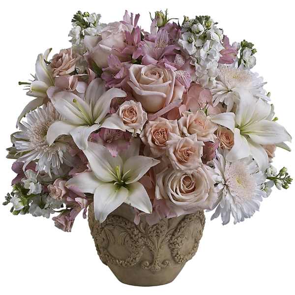 Pink and white floral arrangement in an ornate vase