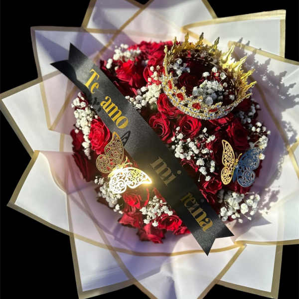Red rose bouquet with a crown and decorative wrap