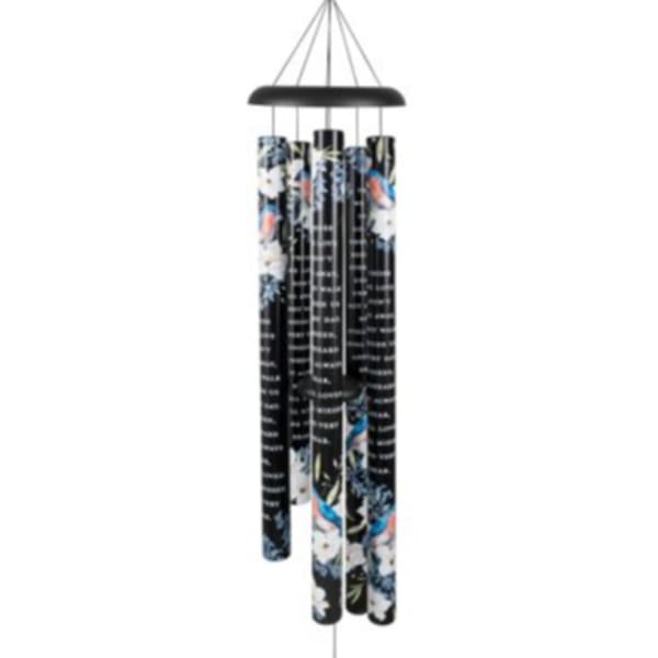 Black metal wind chime with floral pattern and script text on the tubes