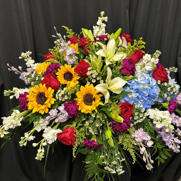 Large mixed bouquet with sunflowers, roses, lilies, hydrangea, and stock