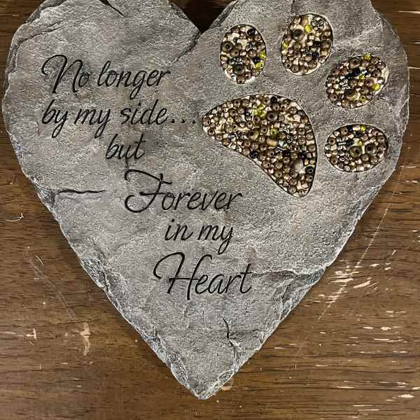 Heart-shaped memorial plaque with paw prints and the words "Forever in my Heart"
