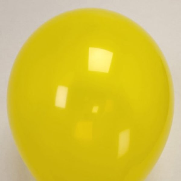 Single yellow balloon against a plain background