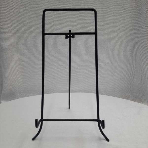 Black metal display stand on a white surface