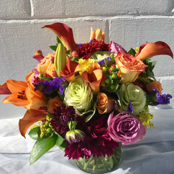 Colorful mixed bouquet in a clear glass vase