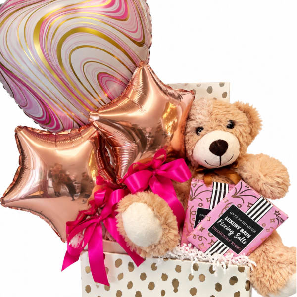 Gift basket with teddy bear, star balloons, and bath salts