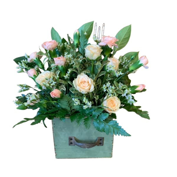 Peach roses and pink carnations in a mint-green box