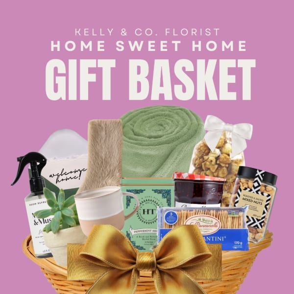 Gift basket with snacks, a mug, a succulent, and home items