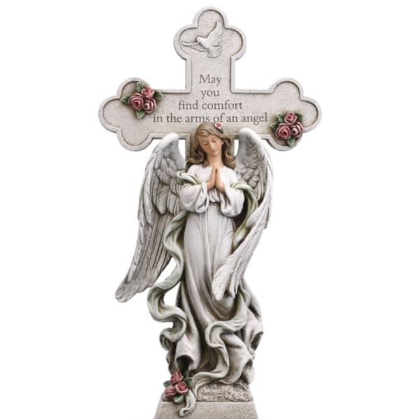 Angel memorial statue with a cross and roses