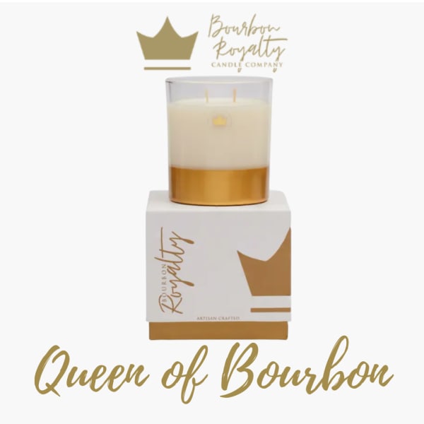 Gold and white candle in a glass jar on a branded box
