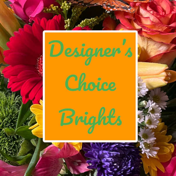 Bright mixed bouquet with gerbera daisies and roses behind a sign