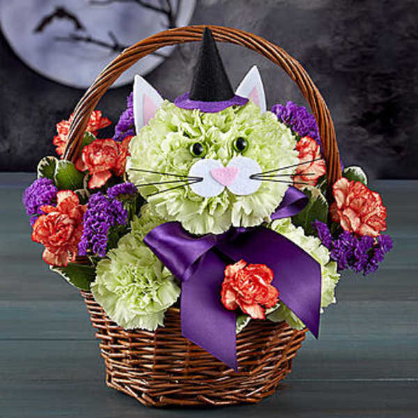 Cat-shaped floral basket with a witch hat and purple bow