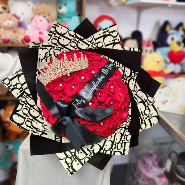 Bouquet of red roses with a jeweled crown and black ribbon wrap
