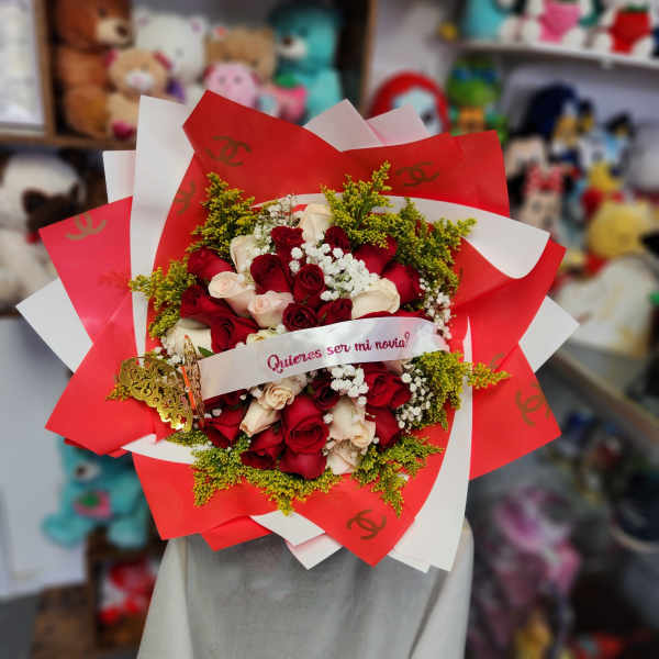 Bouquet of red and cream roses wrapped in red and white paper