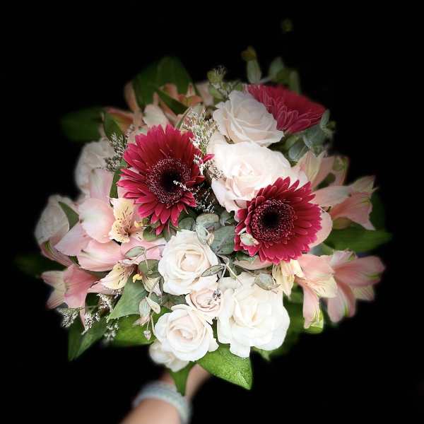 Bouquet of pink gerbera daisies, white roses, and pale pink lilies