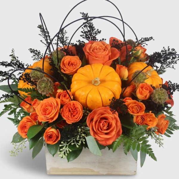 "A Floral Gift with a Touch of Whimsy: The Super Cute Orange Pumpkin Surprise"
