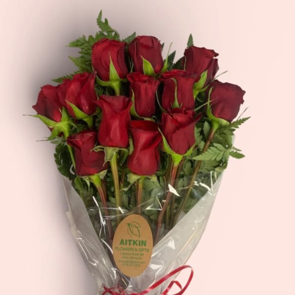Bouquet of red roses wrapped in clear plastic