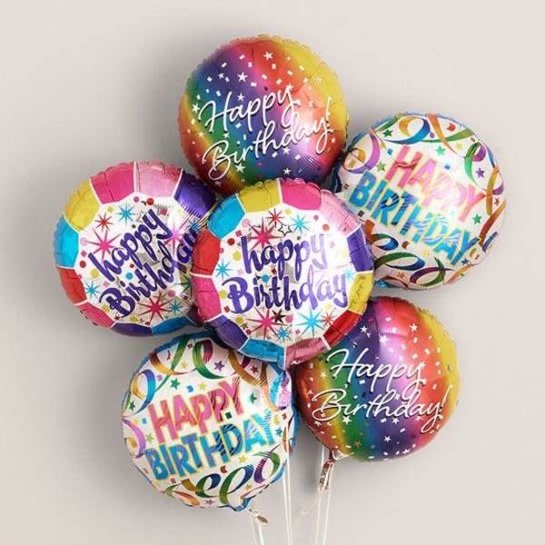 Cluster of colorful Happy Birthday balloons on sticks
