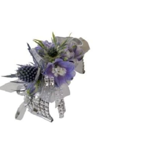 Small purple floral bouquet with silver wrapping and ribbon