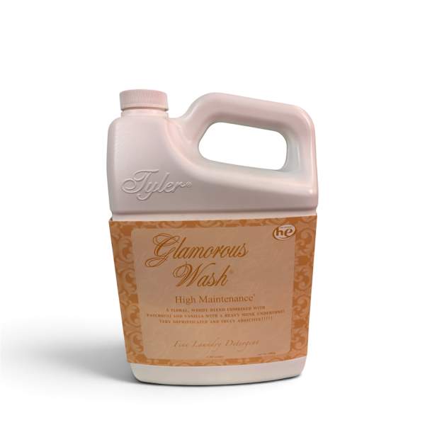 A bottle of Tyler Glamorous Wash laundry detergent with a beige label