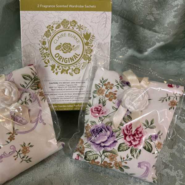 Packaged floral wardrobe sachets with ribbon ties and printed fabric covers